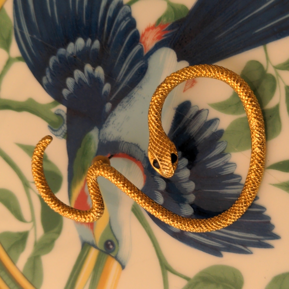 Snake mid-ear pierced earring with black onyx eyes